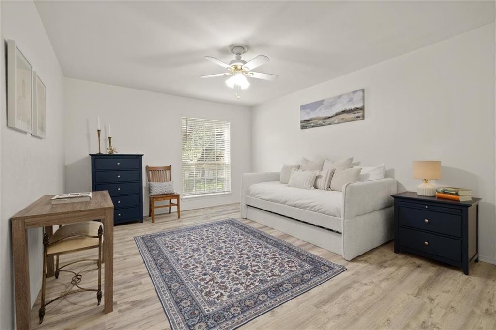 4100 Ridglea Country Club Drive, Unit 1401 Fort Worth, TX 76126 - Photo 13 of 27 a living room with furniture and a dresser