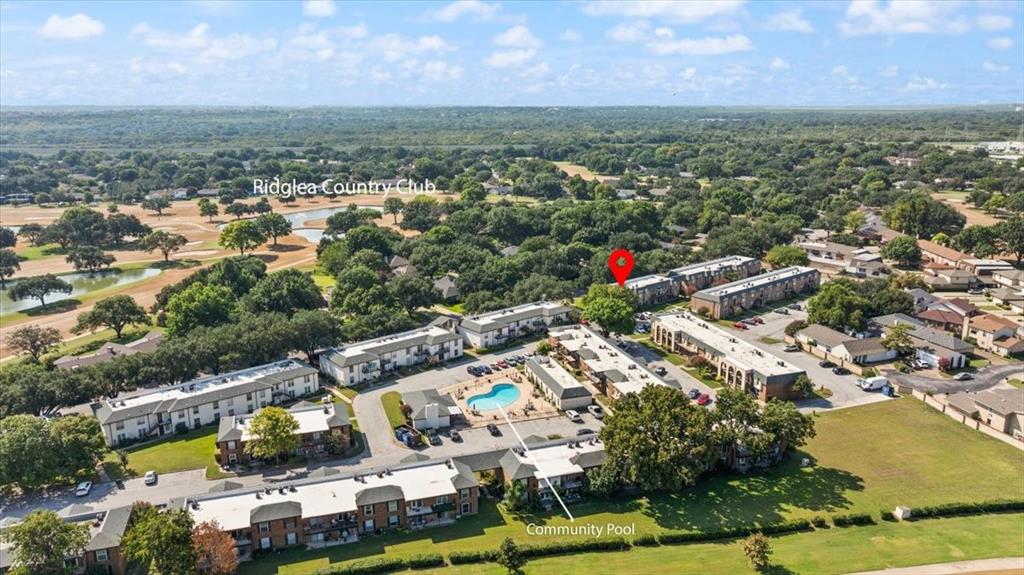 4100 Ridglea Country Club Drive, Unit 1401 Fort Worth, TX 76126 - Photo 8 of 27 an aerial view of residential houses with outdoor space