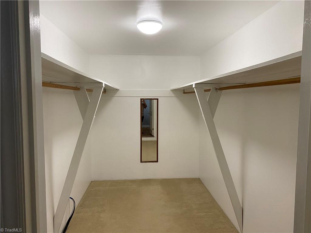 1883 Mountain View Church Road King, NC 27021 - Photo 14 of 38 The primary bedroom has a huge walk-in closet. This home has excellent storage.