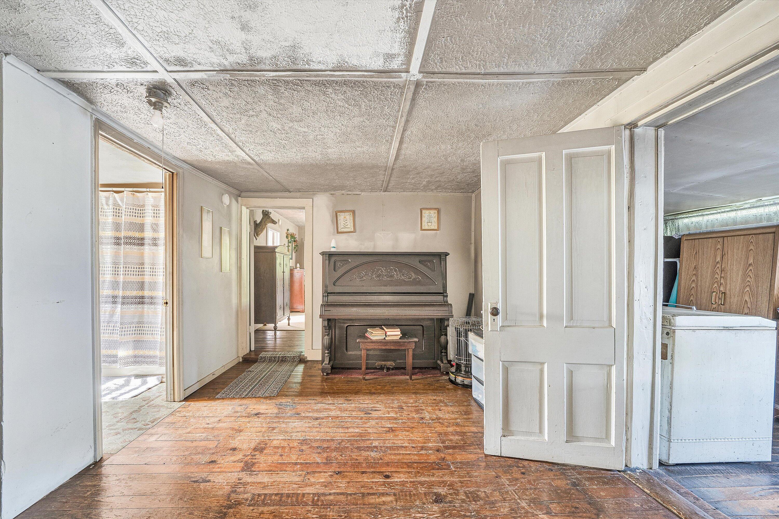 2816 Johns Creek Road New Castle, VA 24127 - Photo 16 of 40 a view of an empty room with a fireplace and a window