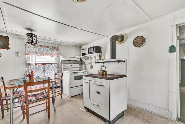 a bathroom with a granite countertop toilet sink and mirror