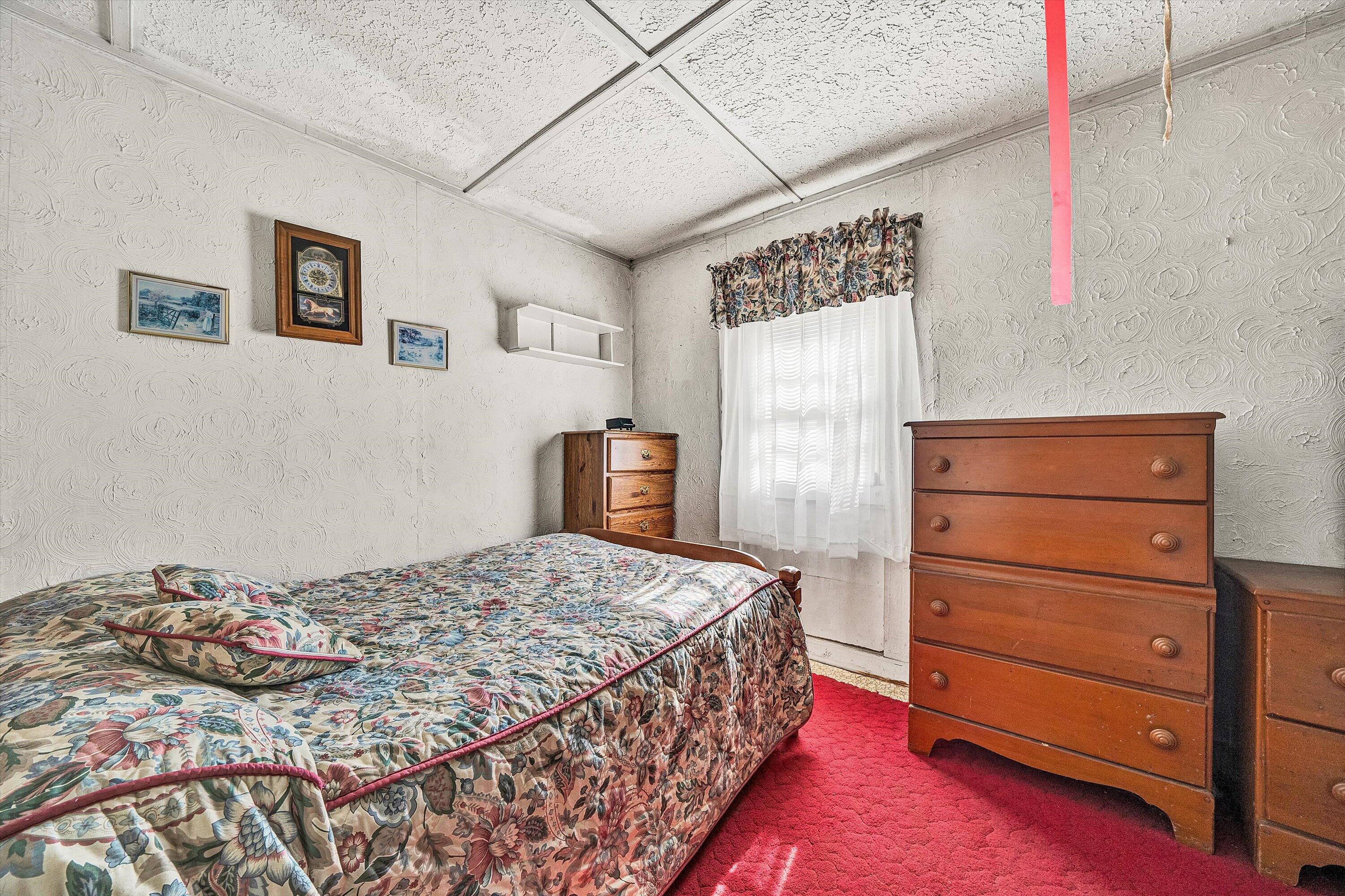 2816 Johns Creek Road New Castle, VA 24127 - Photo 25 of 40 a bedroom with a bed and a dresser