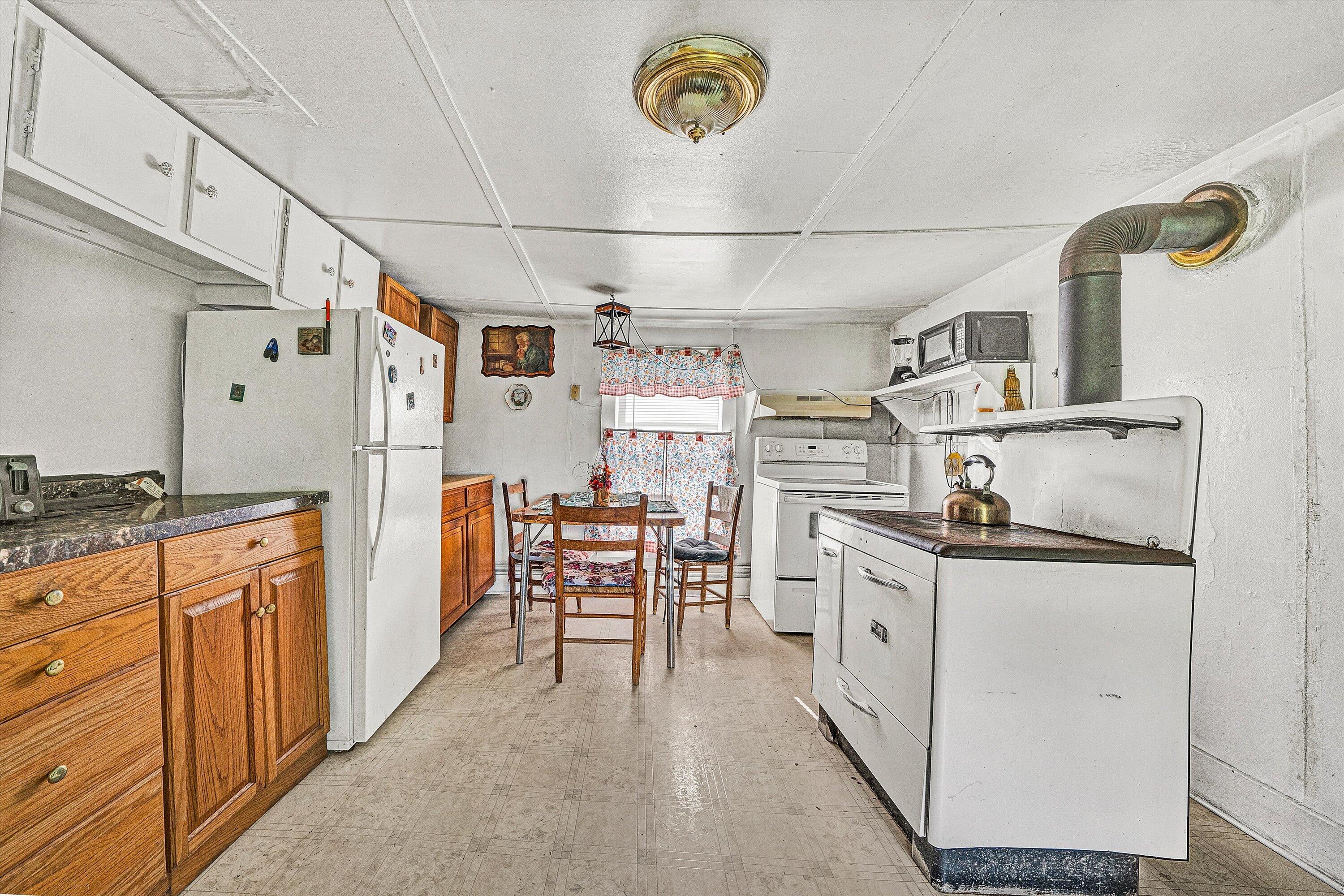2816 Johns Creek Road New Castle, VA 24127 - Photo 66 of 76 a kitchen with stainless steel appliances a stove a sink and a refrigerator