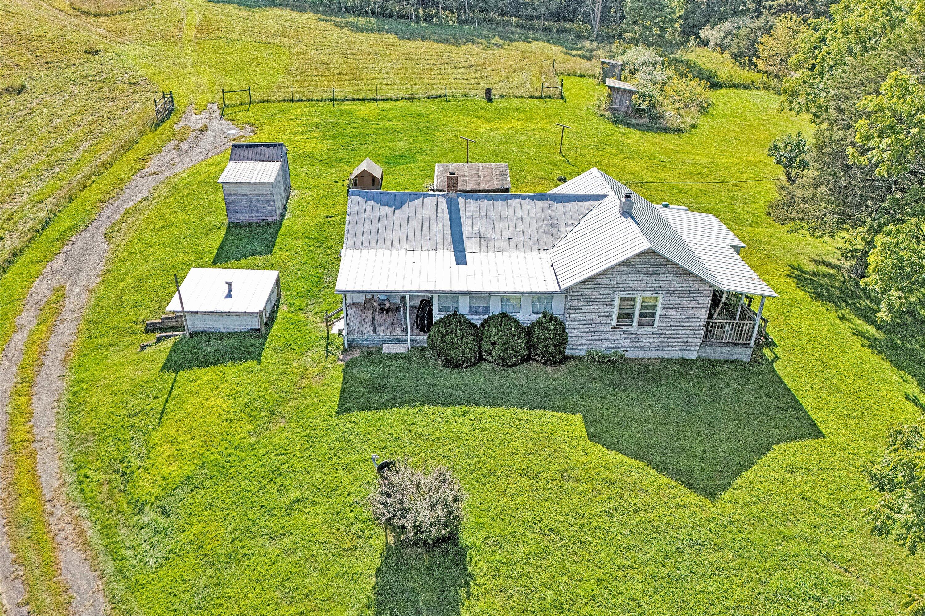 2816 Johns Creek Road New Castle, VA 24127 - Photo 10 of 40 a aerial view of a house with a yard table and chairs
