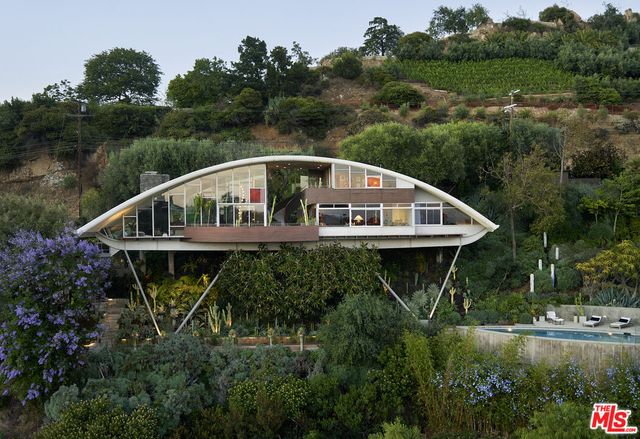 a house with trees in the background