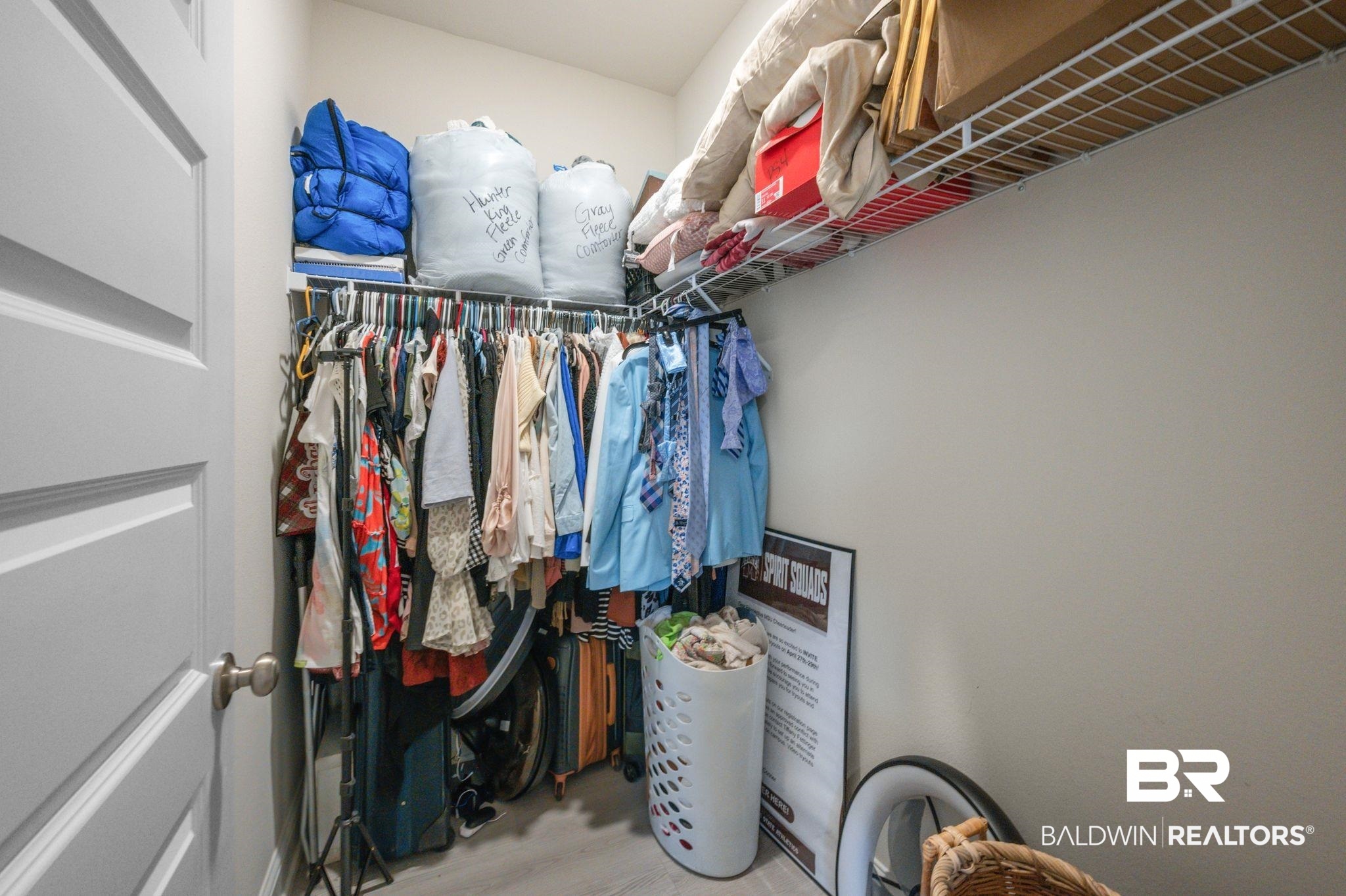 681 Calibre Street Fairhope, AL 36532 - Photo 46 of 56 Walk in closet featuring light hardwood / wood-style flooring