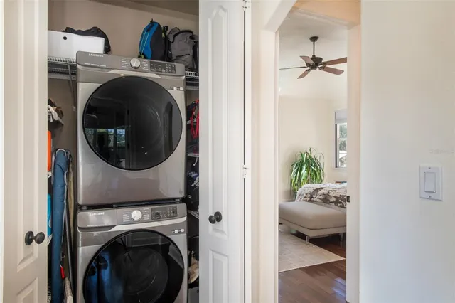 a living room with furniture and a view of bedroom
