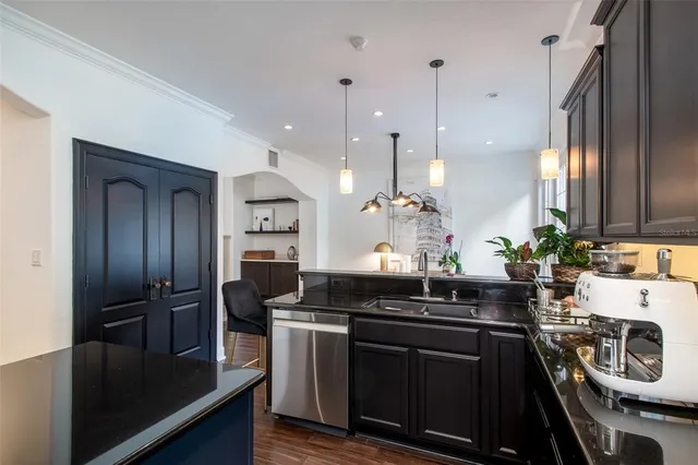 a kitchen with a refrigerator and a sink