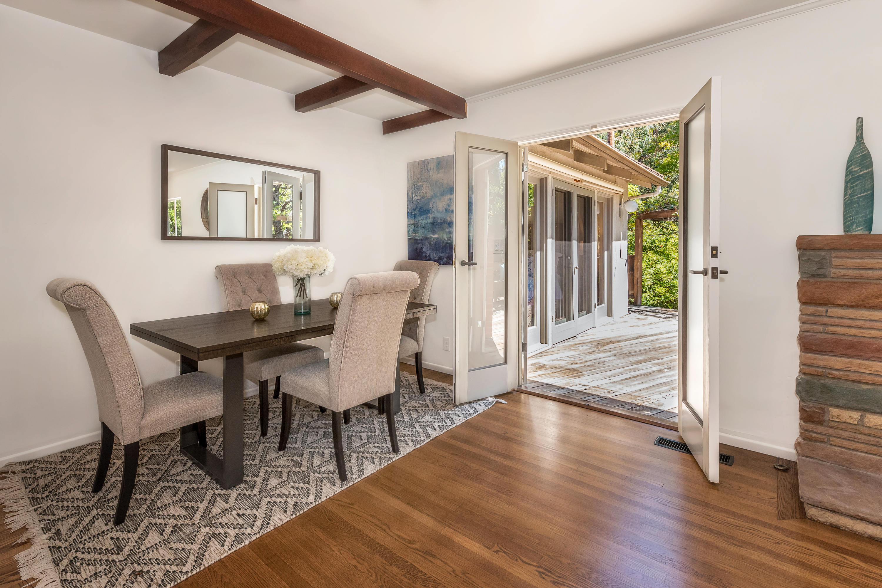 557 Scenic Drive Santa Barbara, CA 93103 - Photo 8 of 21 Dining area with French doors to deck