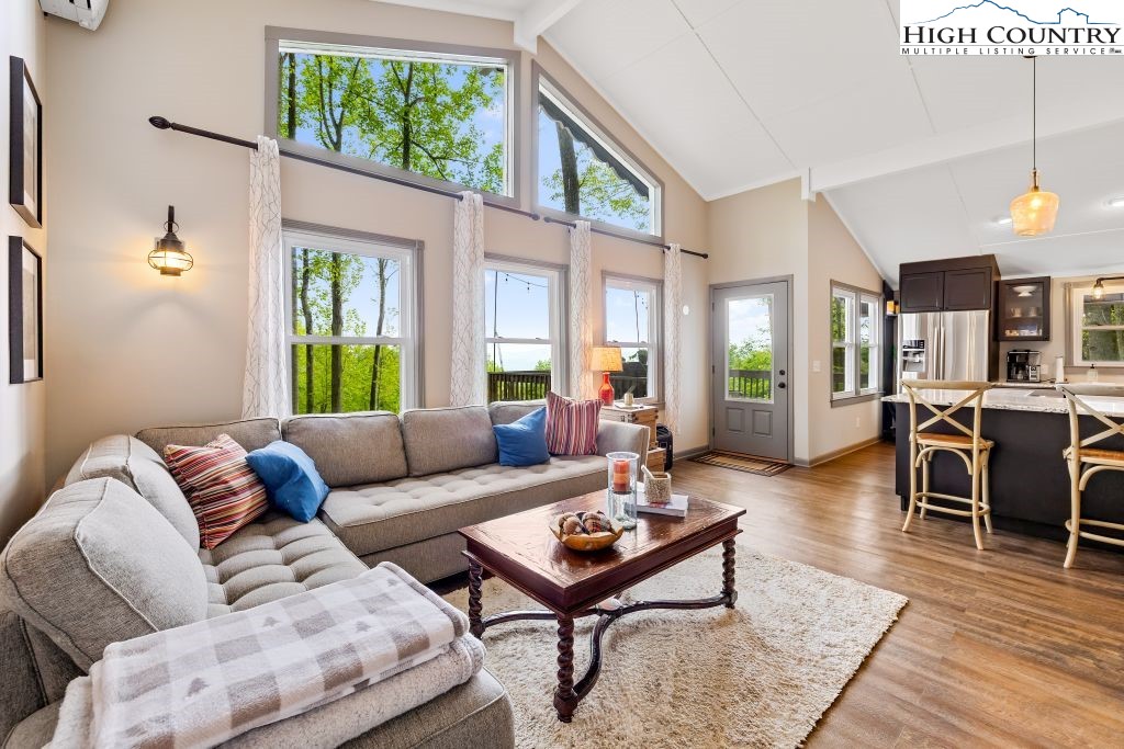 844 Pine Ridge Road Beech Mountain, NC 28604 - Photo 16 of 34 a living room with furniture and a wooden floor