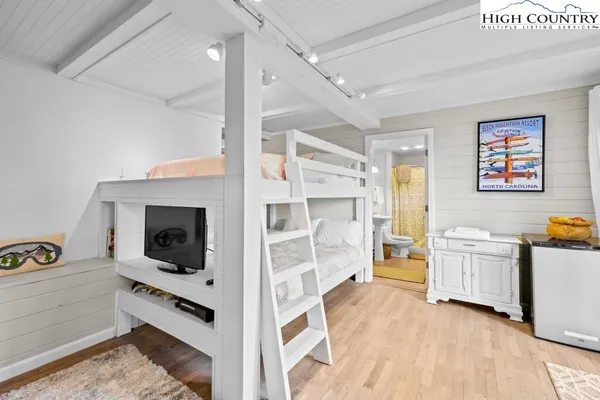 a kitchen with stainless steel appliances a stove top oven and cabinets