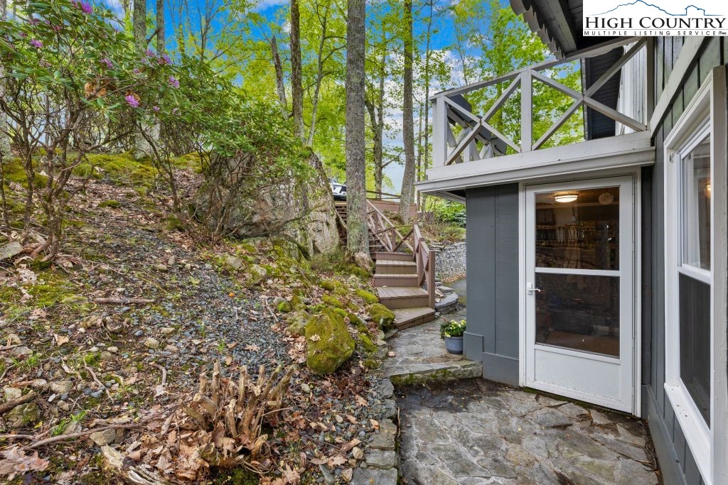 844 Pine Ridge Road Beech Mountain, NC 28604 - Photo 28 of 34 a view of a pathway of a house with a tree