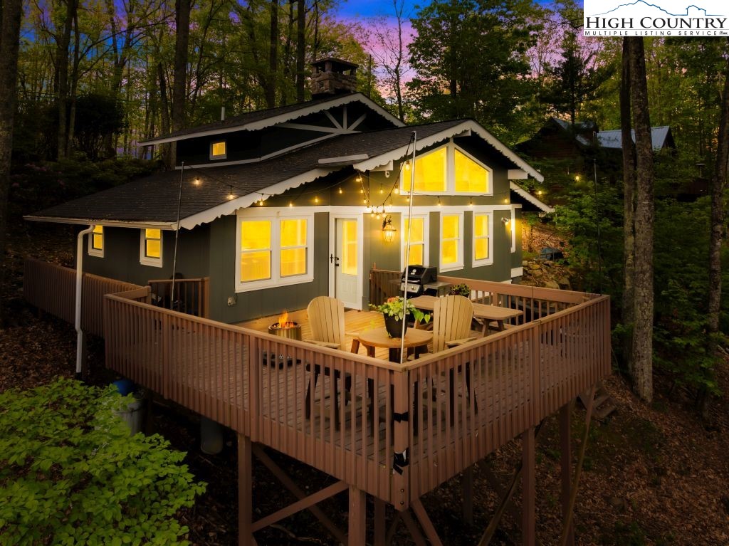844 Pine Ridge Road Beech Mountain, NC 28604 - Photo 4 of 34 a view of swimming pool with seating area and yard