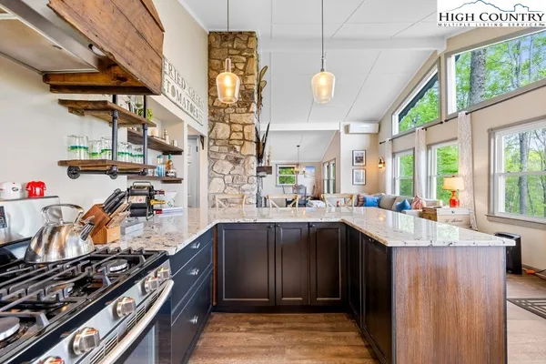 a kitchen that has a lot of cabinets in it