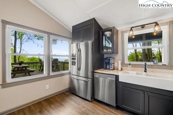 a kitchen with a refrigerator and a sink