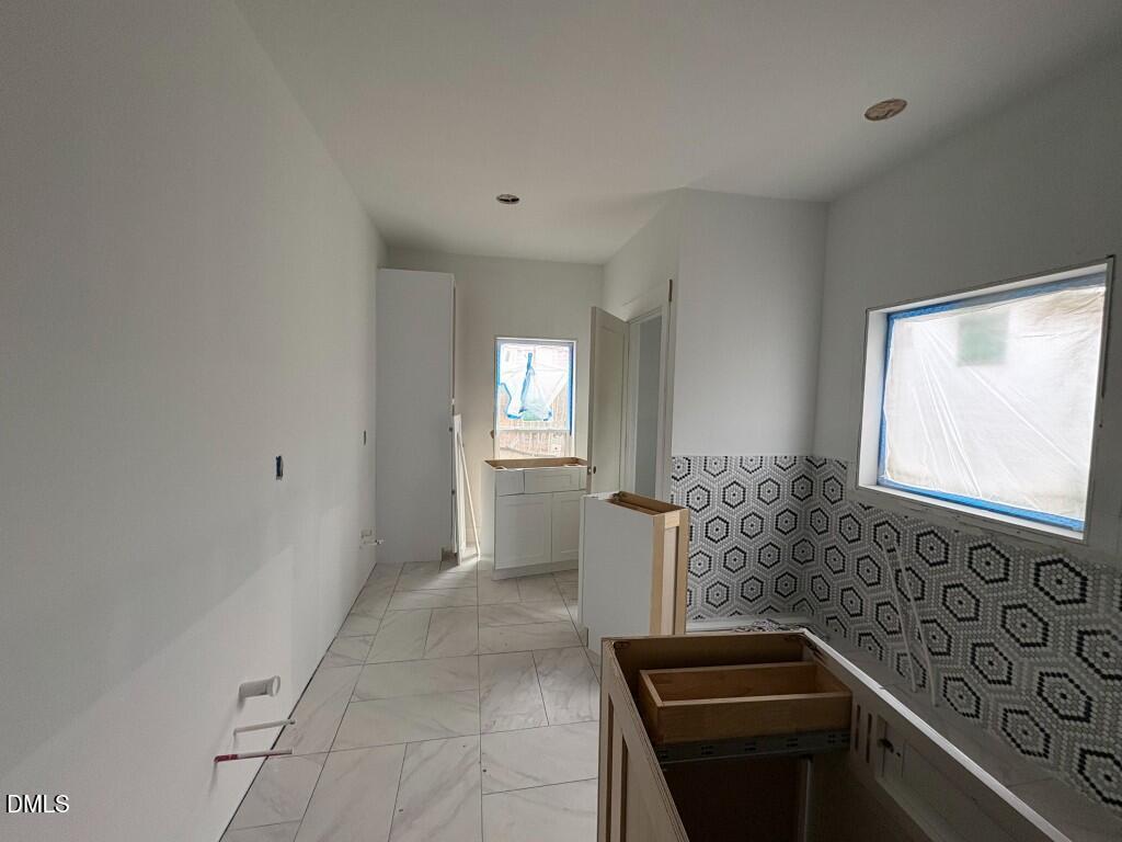 5013 Mitchell Town Road Youngsville, NC 27596 - Photo 8 of 15 a kitchen with granite countertop a sink and a stove