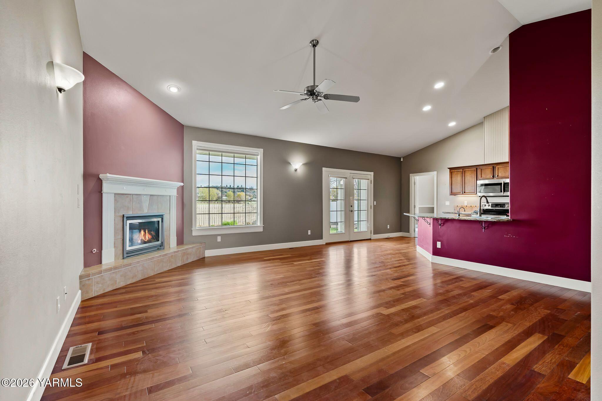 8507 Midvale Road Yakima, WA 98908 - Photo 5 of 24 a view of an empty room with wooden floor and a window