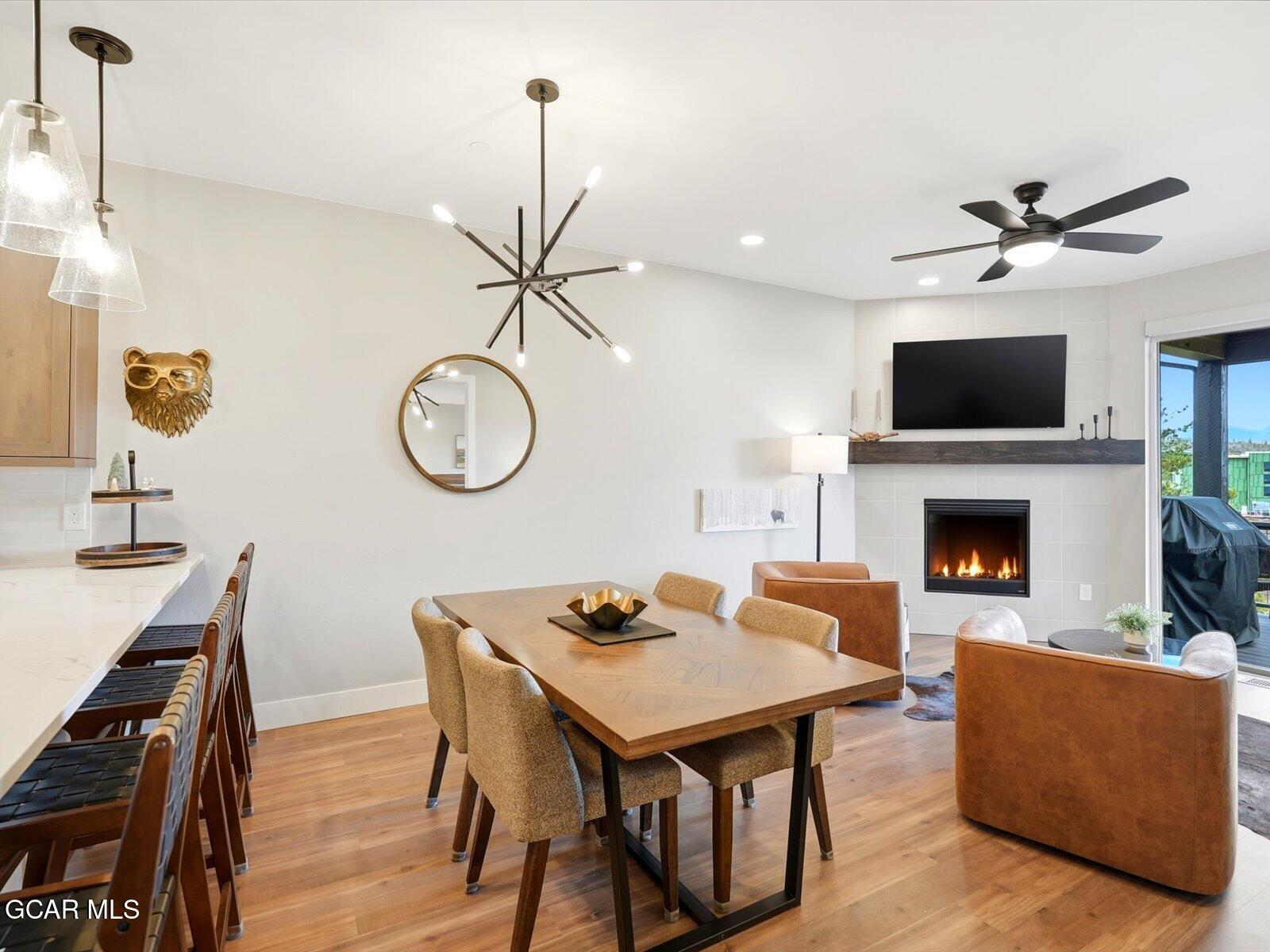 95 River Run Circle Fraser, CO 80442 - Photo 24 of 66 a living room with furniture a fireplace and a flat screen tv