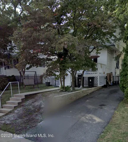 front view of a house with a street