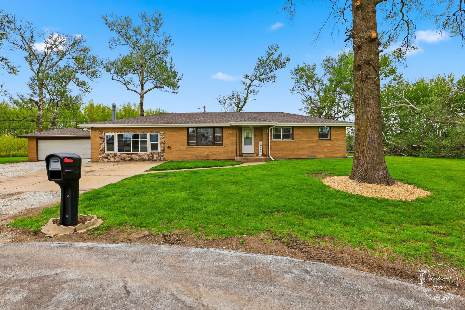 235 East 2740s Road Kankakee, IL 60901 - Photo 1 of 22 a front view of a house with a yard and potted plants