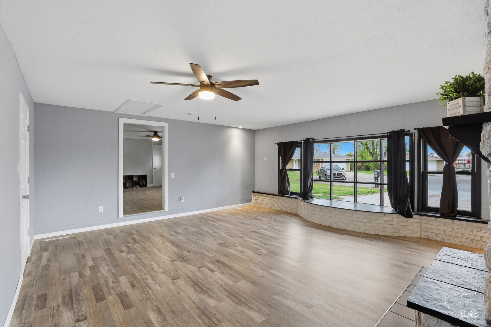 235 East 2740s Road Kankakee, IL 60901 - Photo 11 of 22 a view of an empty room with a window and a kitchen