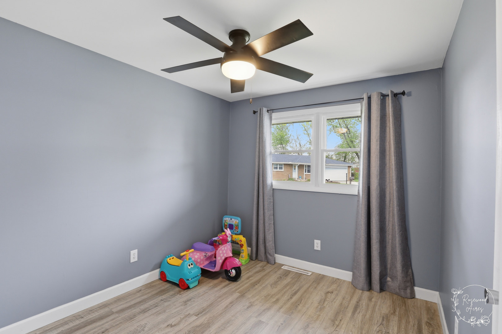 235 East 2740s Road Kankakee, IL 60901 - Photo 15 of 22 an empty room with wooden floor and windows