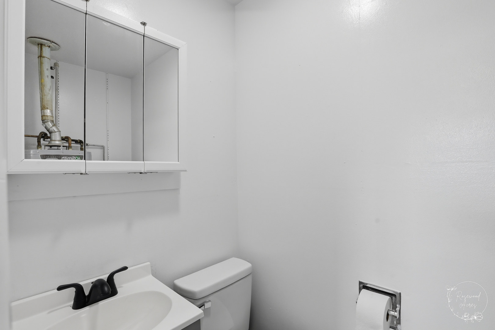 235 East 2740s Road Kankakee, IL 60901 - Photo 17 of 22 a bathroom with a toilet sink and mirror