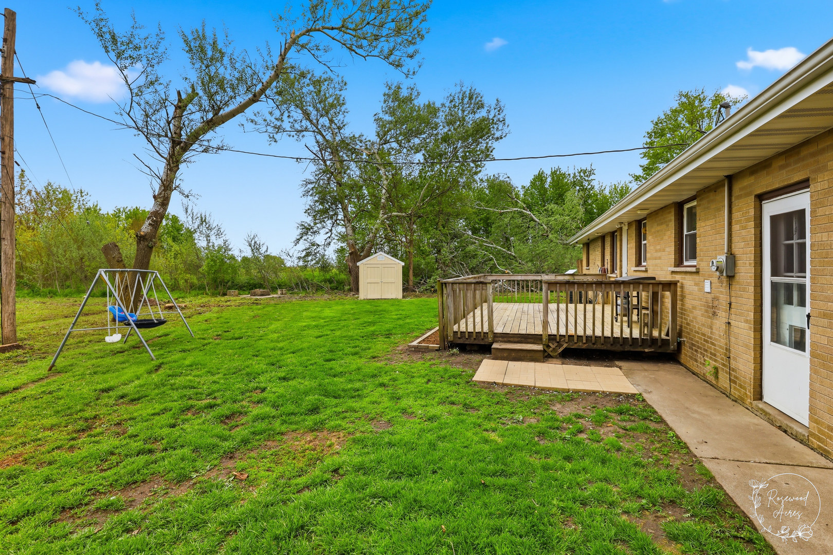 235 East 2740s Road Kankakee, IL 60901 - Photo 19 of 22 a view of a deck with a big yard potted plants and large tree