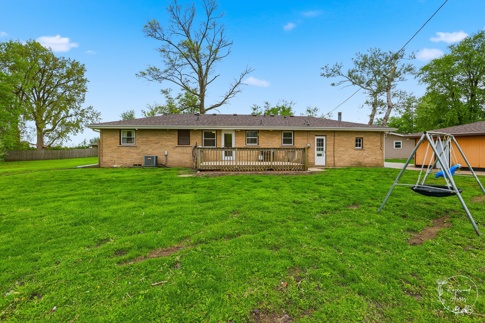 235 East 2740s Road Kankakee, IL 60901 - Photo 20 of 22 a view of a house with a yard and palm trees
