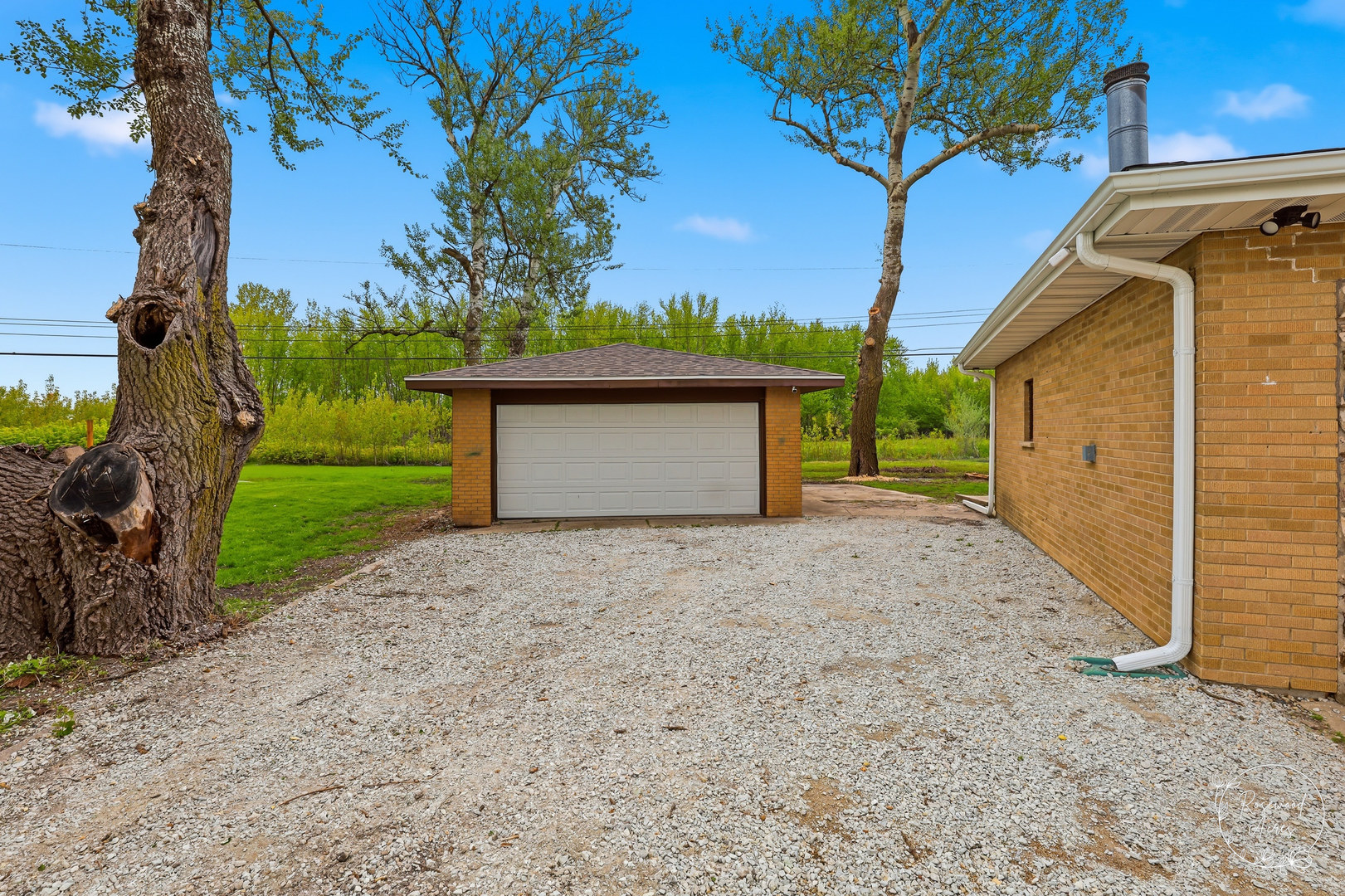 235 East 2740s Road Kankakee, IL 60901 - Photo 22 of 22 a view of a house with a yard and garage