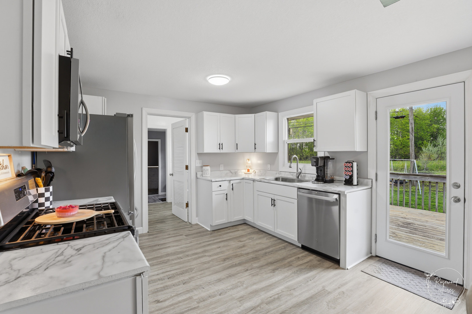 235 East 2740s Road Kankakee, IL 60901 - Photo 5 of 22 a kitchen with a sink stove and refrigerator