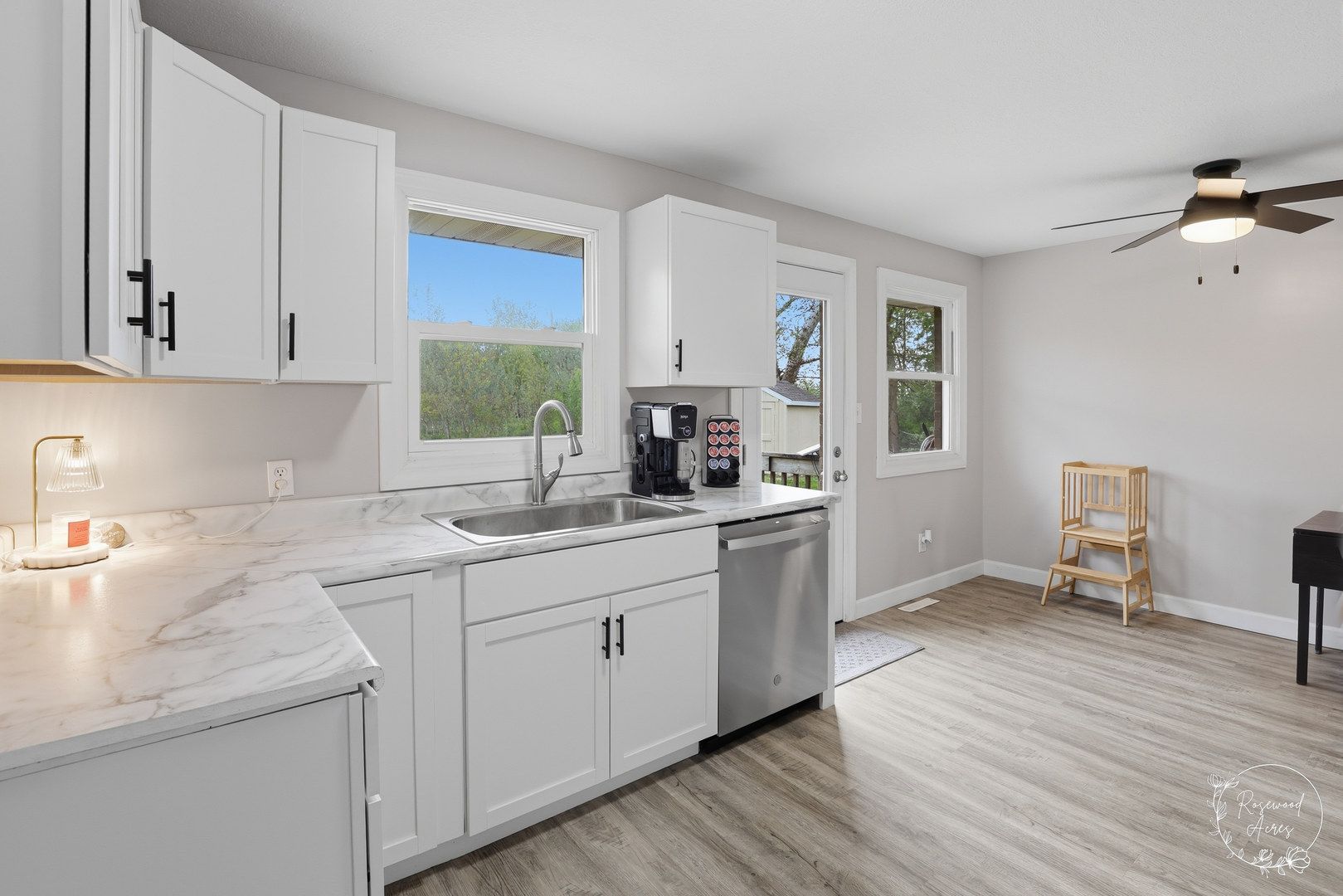 235 East 2740s Road Kankakee, IL 60901 - Photo 7 of 22 a kitchen with a sink cabinets and wooden floor
