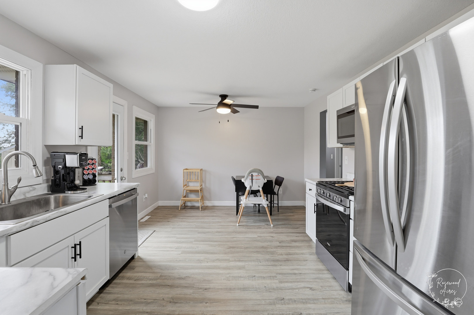 235 East 2740s Road Kankakee, IL 60901 - Photo 8 of 22 a kitchen with granite countertop a refrigerator stove and sink
