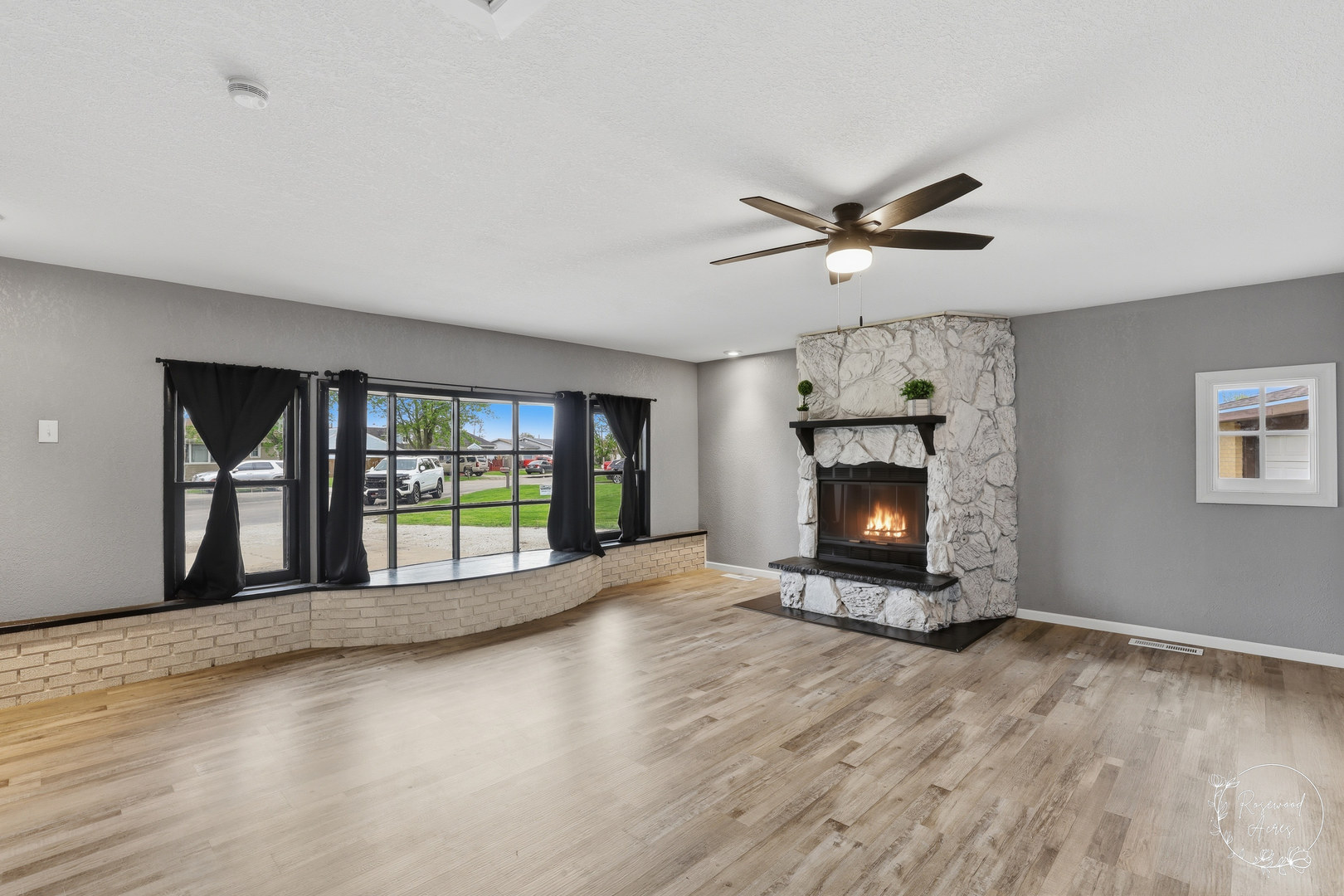 235 East 2740s Road Kankakee, IL 60901 - Photo 9 of 22 a view of an empty room with a fireplace and a window