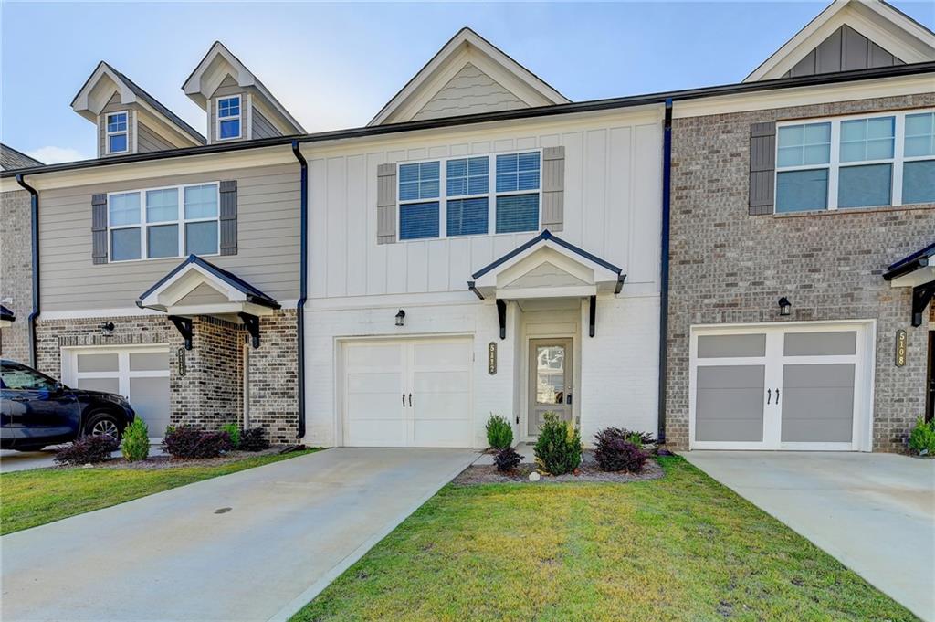 5112 Fox Den Road Oakwood, GA 30566 - Photo 1 of 1 front view of a house with a yard