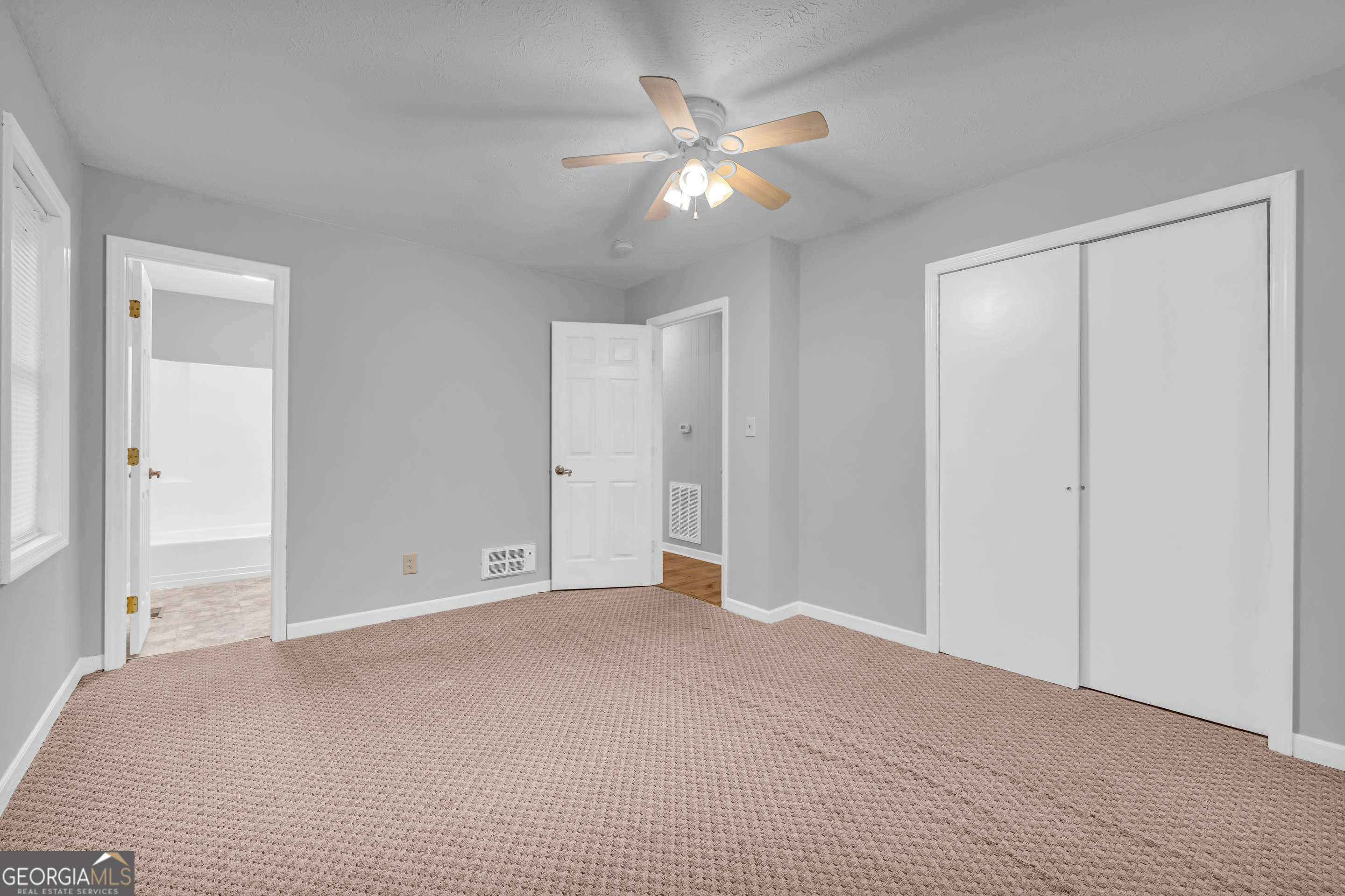 73 Highland Estates Commerce, GA 30529 - Photo 13 of 55 a view of an empty room with a ceiling fan