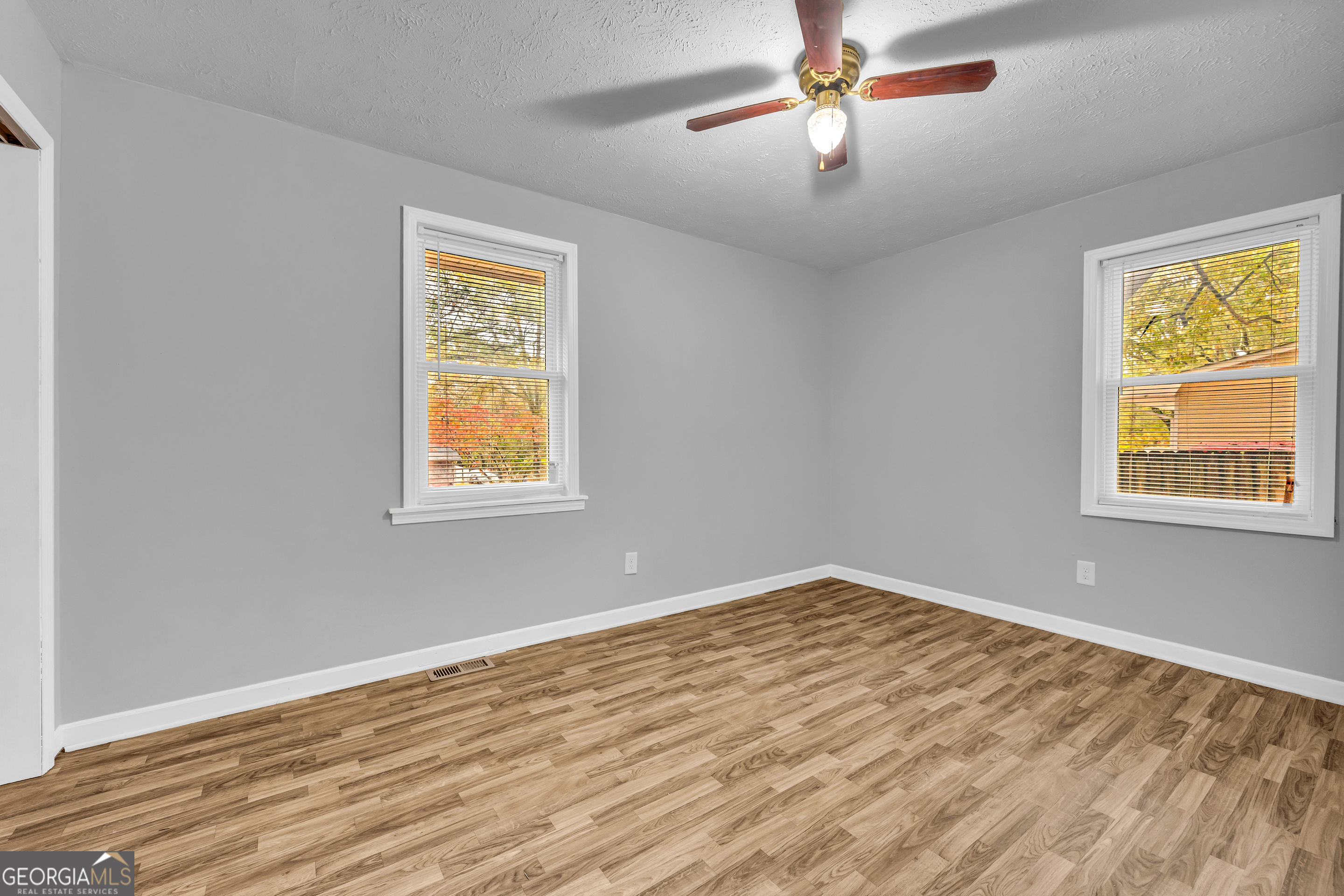 73 Highland Estates Commerce, GA 30529 - Photo 19 of 55 a view of an empty room with window and wooden floor