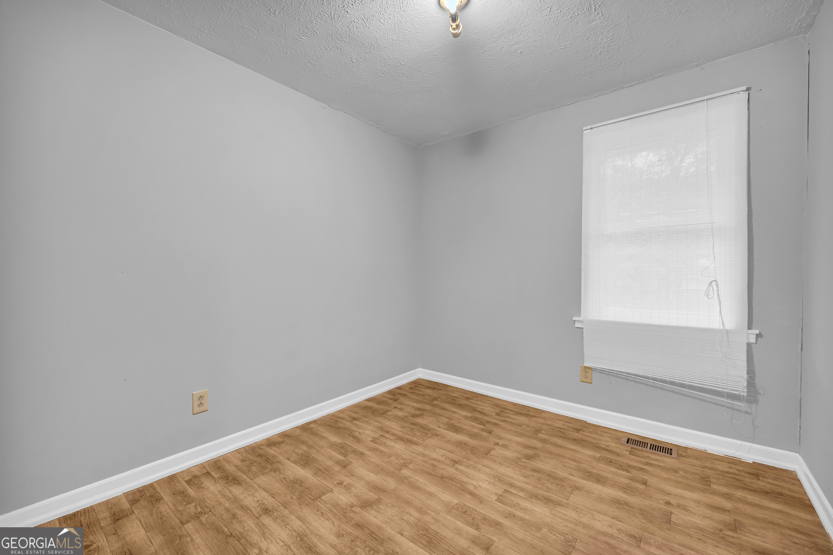 73 Highland Estates Commerce, GA 30529 - Photo 21 of 55 a view of empty room with wooden floor