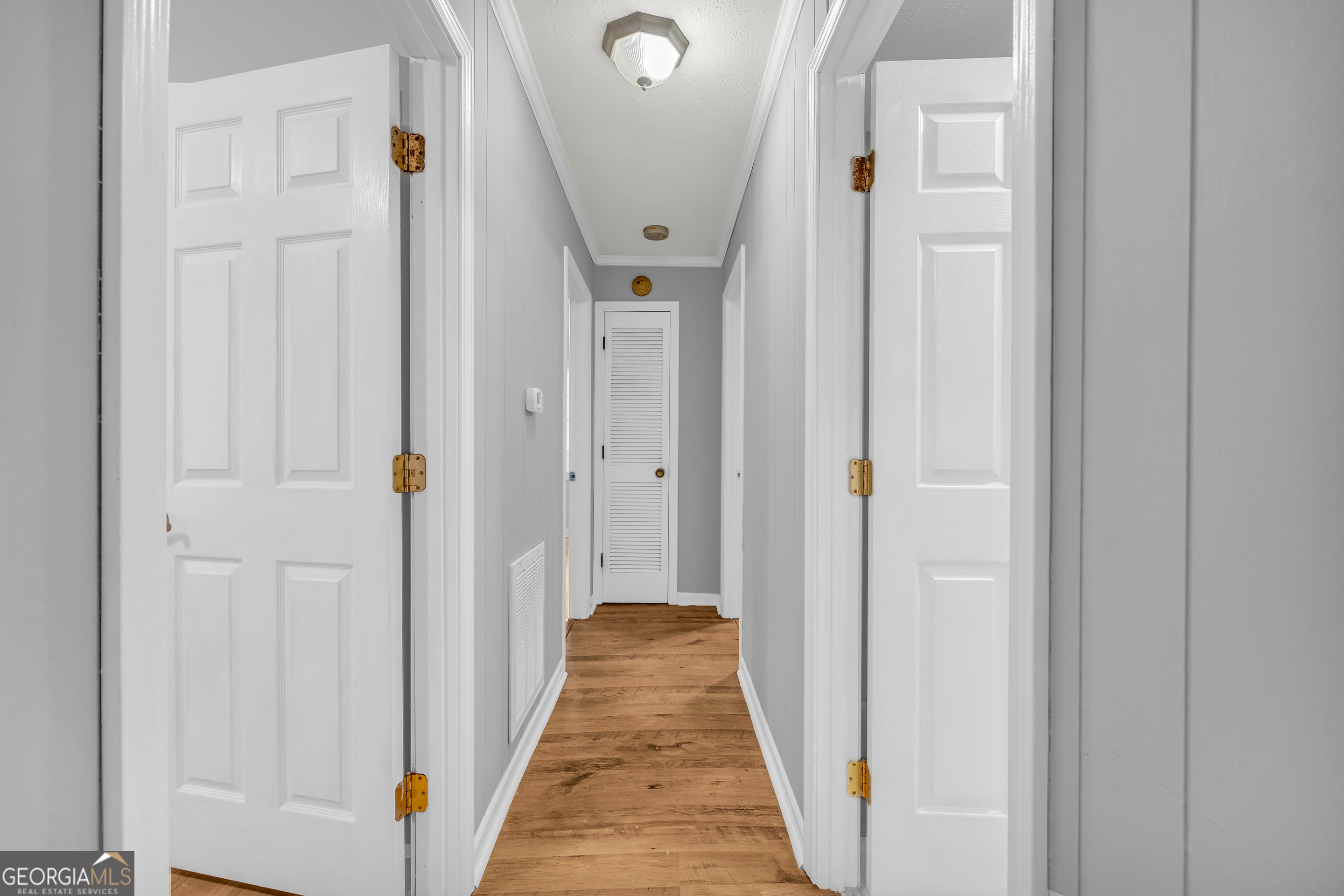 73 Highland Estates Commerce, GA 30529 - Photo 23 of 55 a view of a hallway with wooden floor and staircase