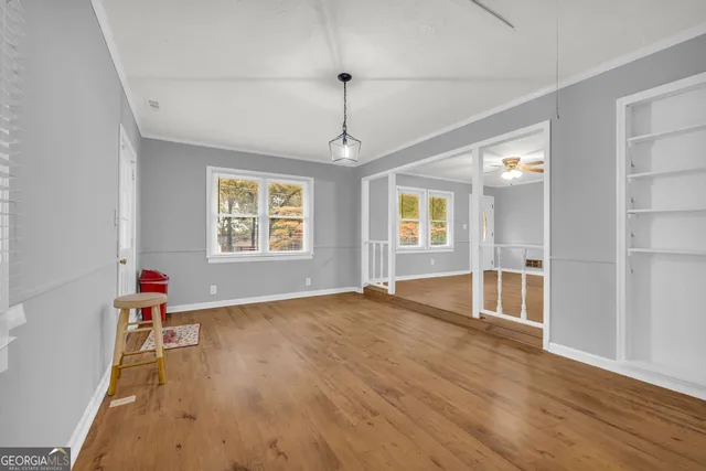 a view of an empty room with a window