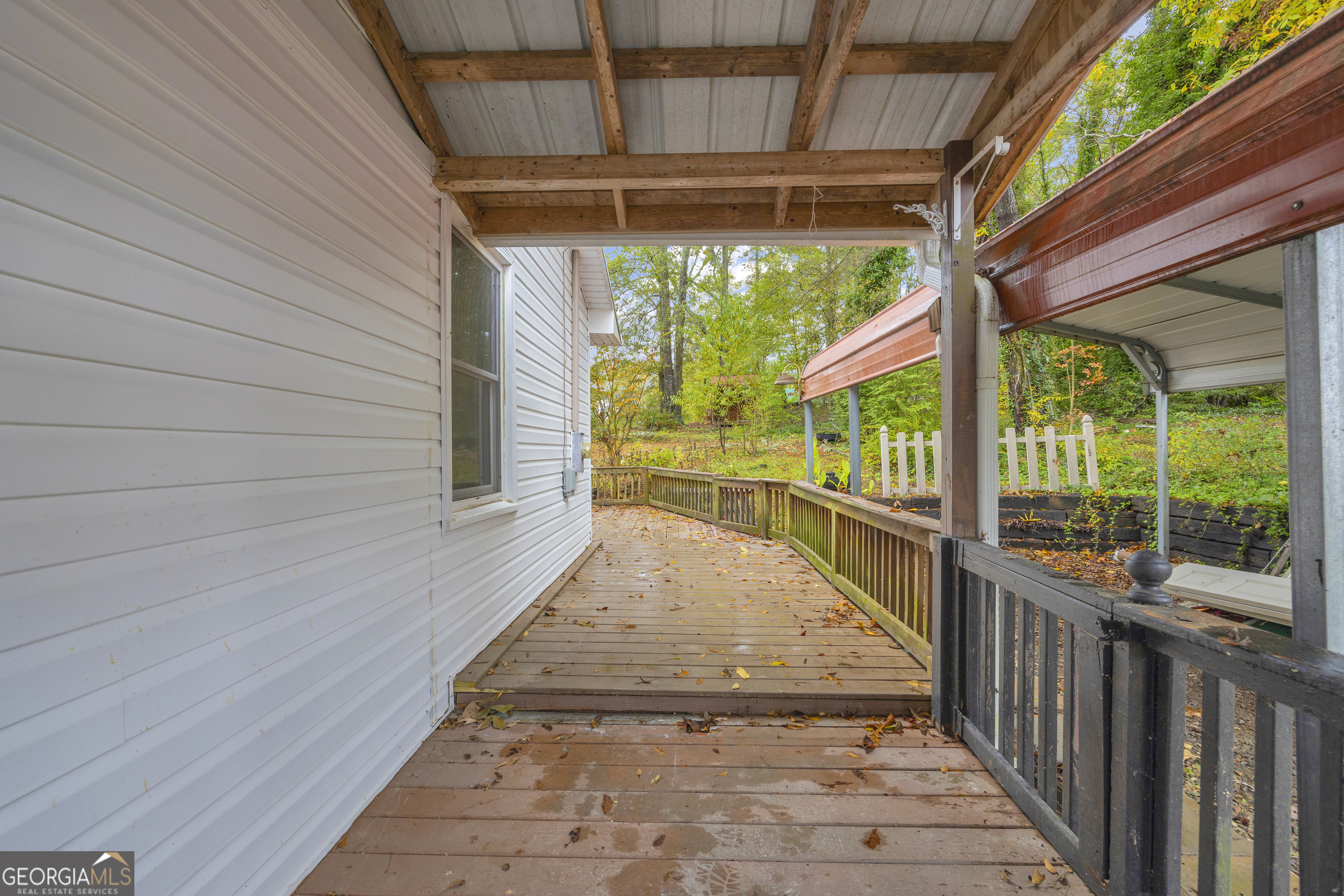 73 Highland Estates Commerce, GA 30529 - Photo 36 of 55 a view of a porch with wooden floor and outdoor space