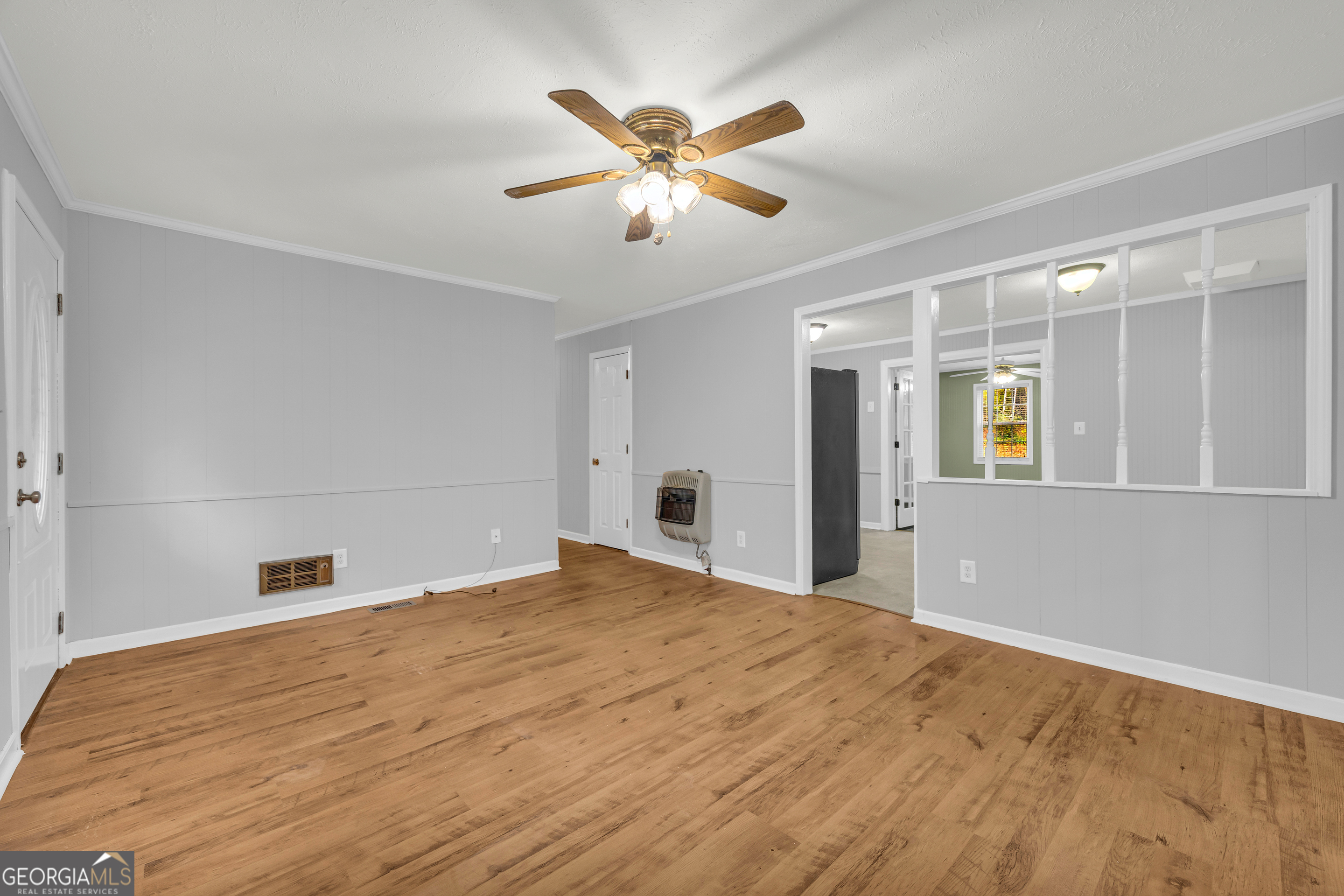 73 Highland Estates Commerce, GA 30529 - Photo 7 of 55 a view of an empty room with window and a ceiling fan