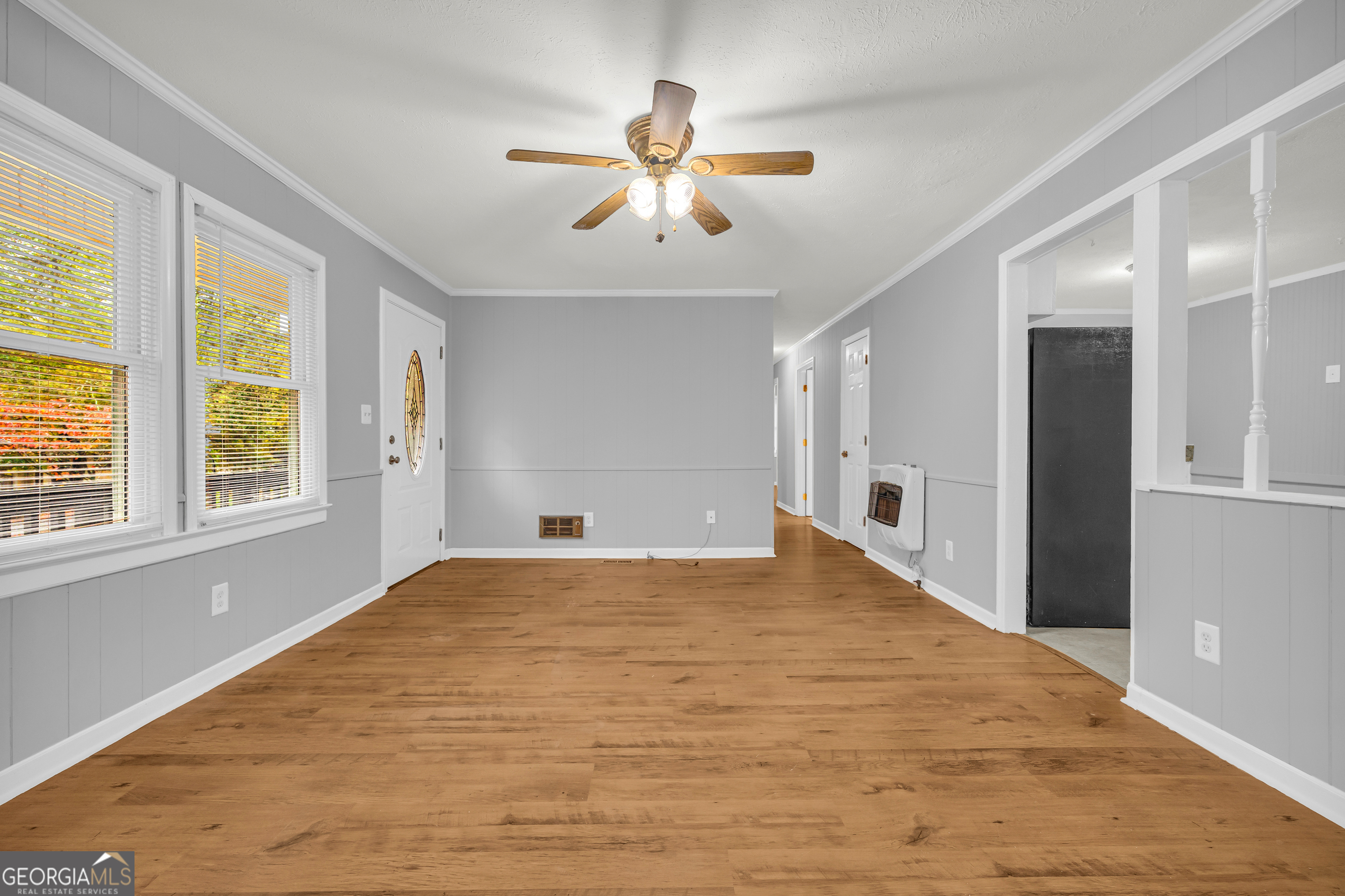 73 Highland Estates Commerce, GA 30529 - Photo 8 of 55 a view of an empty room with window and cabinet