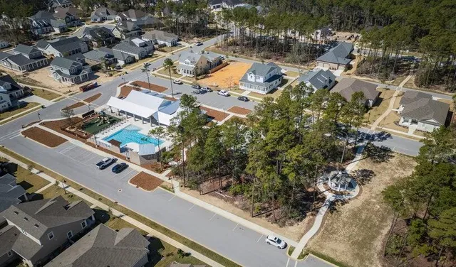 an aerial view of residential houses with outdoor space