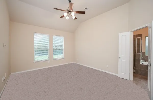 a view of an empty room with a window