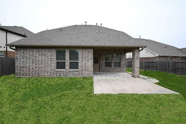 a front view of a house with yard