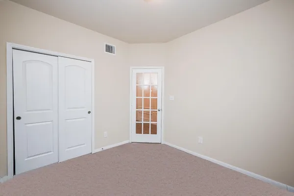 a view of an empty room with a window