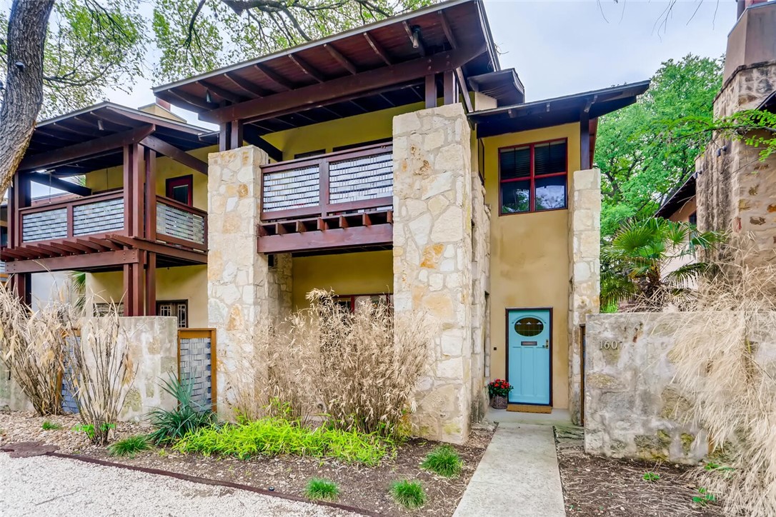 1607 Ravey Street, Unit 1607 Austin, TX 78704 - Photo 1 of 1 a front view of a house with a garden