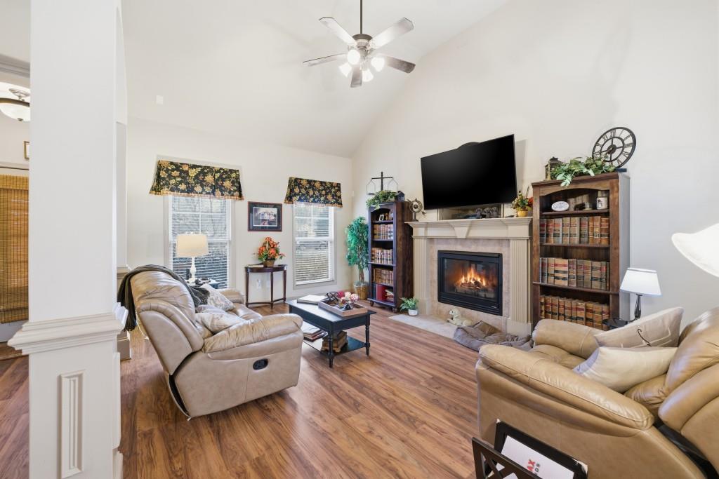 53 Bobbin Court Jefferson, GA 30549 - Photo 13 of 40 a living room with furniture a flat screen tv and a fireplace