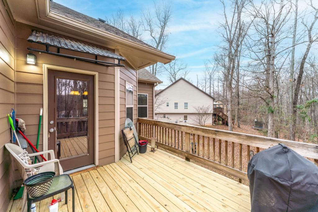 53 Bobbin Court Jefferson, GA 30549 - Photo 18 of 40 a view of wooden house with large windows